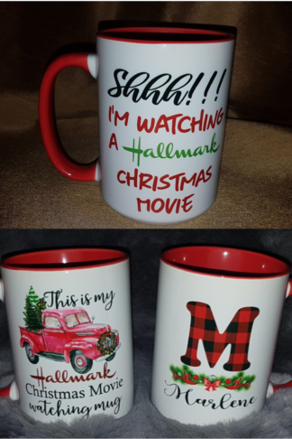 A personalized 15 oz sublimation mug featuring festive holiday designs with text that reads, "This is my Hallmark Christmas Movie Watching Mug." or "Shhh I'm watching a Hallmark Christmas Movie" The mug is white with a glossy finish, perfect for sipping hot beverages during holiday movie nights, and can be customized with a name for a personal touch.