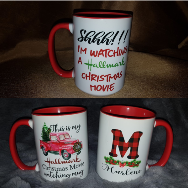 A personalized 15 oz sublimation mug featuring festive holiday designs with text that reads, "This is my Hallmark Christmas Movie Watching Mug." or "Shhh I'm watching a Hallmark Christmas Movie" The mug is white with a glossy finish, perfect for sipping hot beverages during holiday movie nights, and can be customized with a name for a personal touch.