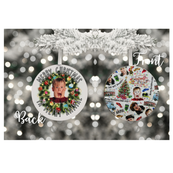 "Festive round ornament with the phrase 'Merry Christmas Ya Filthy Animal' in bold, playful font, surrounded by Christmas-themed decorations like snowflakes and trees, in vibrant red, green, and white colors."