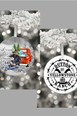 "Round ceramic ornament featuring Kayce Dutton from Yellowstone, with a rugged Western look and cowboy hat. The background showcases the Red Christmas Truck and the Yellowstone Mountains. On the other side is the Yellowstone Ranch the iconic 'Y' brand logo. And in bold Western-style lettering, it reads 'All I Want for Christmas is Rip.'