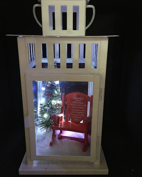 Elegant memorial lantern with soft LED lights, a customized photo, names and dates, creating a beautiful tribute to a loved one.