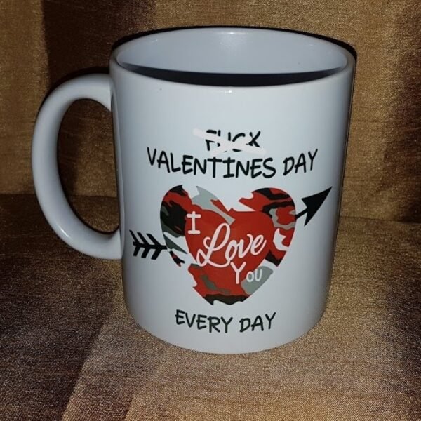 "White 15 oz. ceramic mug with the bold text 'F*ck Valentine's Day, I Love You Every Day' sublimated in vibrant colors, showcasing a quirky and heartfelt design. Perfect for daily use, dishwasher and microwave safe."