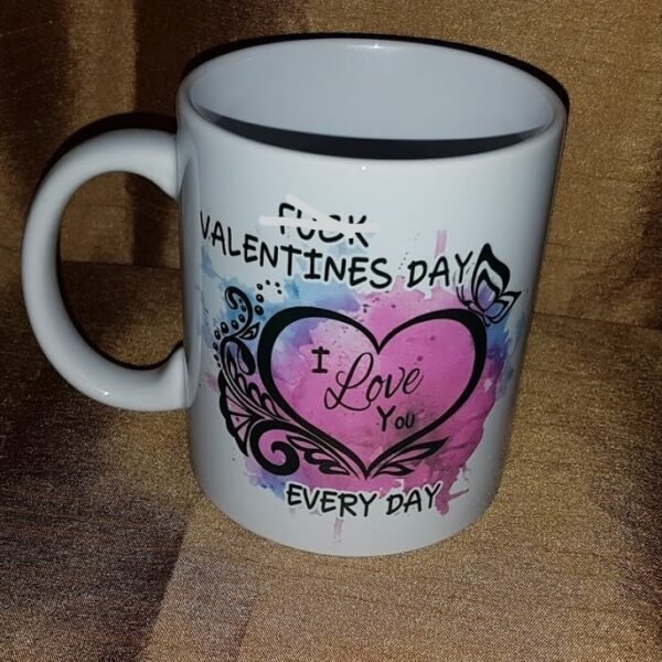 "White 15 oz. ceramic mug with the bold text 'F*ck Valentine's Day, I Love You Every Day' sublimated in vibrant colors, showcasing a quirky and heartfelt design. Perfect for daily use, dishwasher and microwave safe."