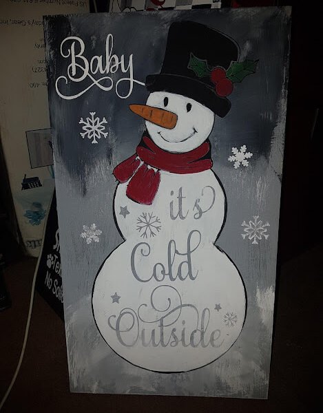 Hand painted pine wood sign featuring a rustic Snowman and the saying Baby It's Cold Outside. , rustic holiday décor with vintage charm, ready to hang or gift. Baby It’s Cold Outside Wood Sign | Handpainted Solid Pine | Rustic Farmhouse Winter Décor | Handmade Christmas Gift