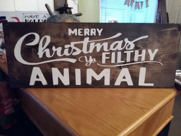 Merry Christmas Ya Filthy Animal Wood Sign | Handpainted Rustic Holiday Décor | Funny Farmhouse Christmas Gift Handpainted solid pine wood sign reading “Merry Christmas Ya Filthy Animal” in festive rustic lettering.