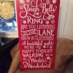 Handpainted solid pine wood Christmas sign featuring the phrase “With Silver Bells” in festive rustic lettering.